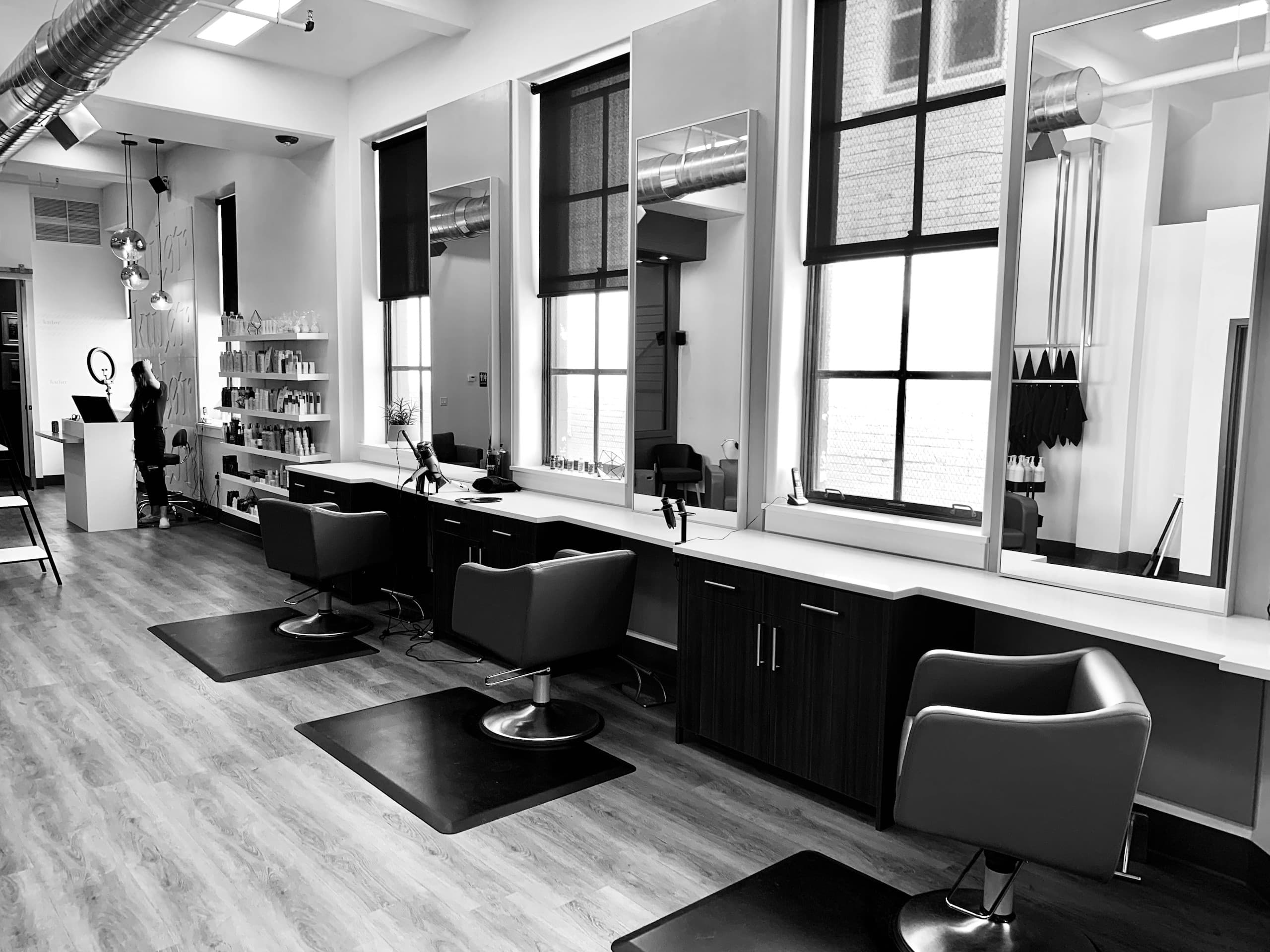 Luxury hair salon interior with elegant styling stations